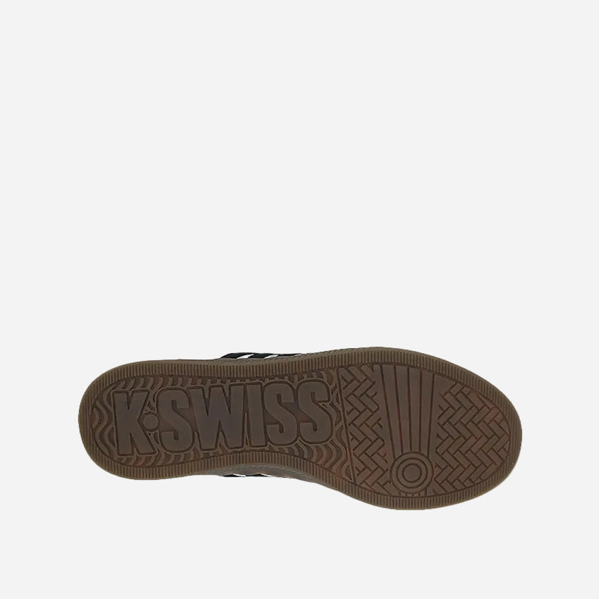 A women's sneaker with a white microfiber upper, black stripes, a brown foam cushion insole, and a black rubber outsole.
